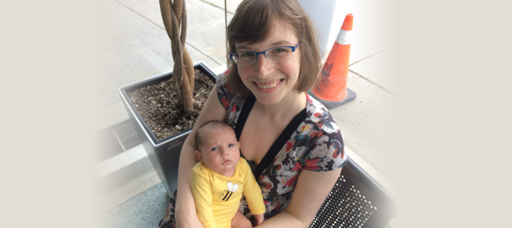 a person holding a baby in their arms