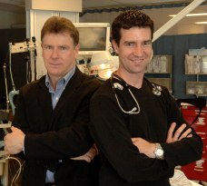 two people standing in a hospital emergency department