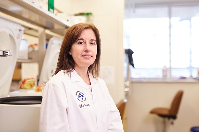 A researcher stands in a lab