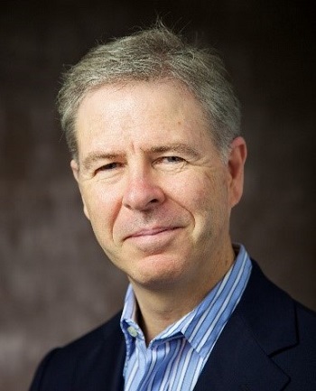 A man in a blue shirt and jacket