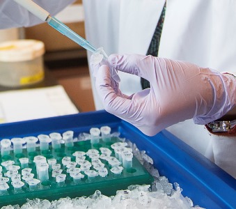 Close-up of hand pipetting 