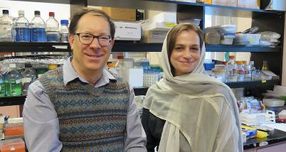 two people standing in a lab