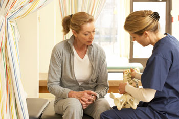 two people sitting in a hospital room