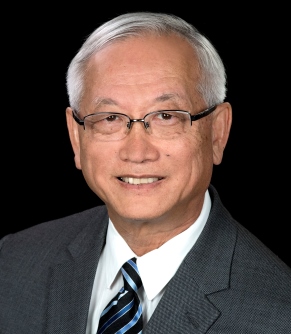 a person in a suit and tie smiling