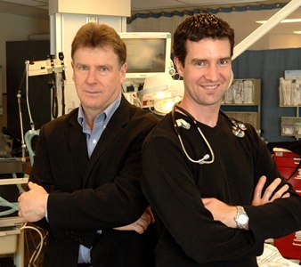 two people standing in a hospital room