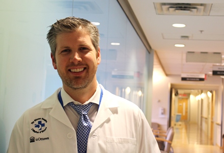 a person in a white lab coat and tie