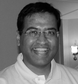 a person in a white shirt and glasses