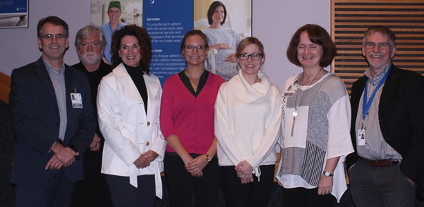 a group of people standing in a room