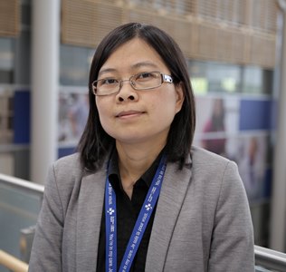 a person in a grey jacket