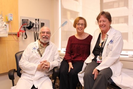 three people in a hospital room