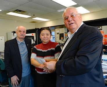 three people in a lab