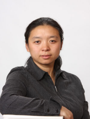 a person in a black shirt is sitting at a table