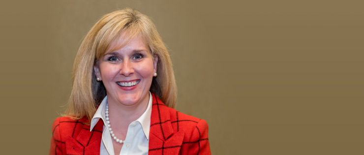 a person in a red jacket and white shirt