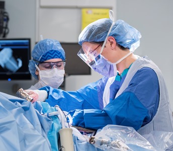 two surgeons in a hospital operating