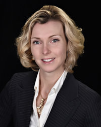 a person in a suit and tie posing for a picture